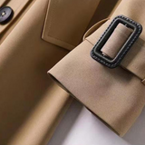 Lang dobbeltspent trenchcoat for dame med belte