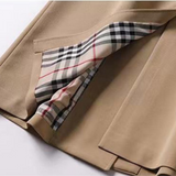 Lang dobbeltspent trenchcoat for dame med belte