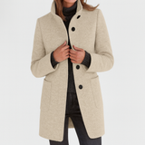 Elegant damekåpe med ståkrage og knapper