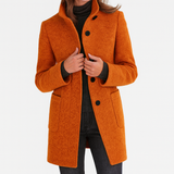 Elegant damekåpe med ståkrage og knapper