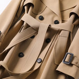 Lang dobbeltspent trenchcoat for dame med belte