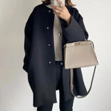Elegant lang oversize-kåpe for dame