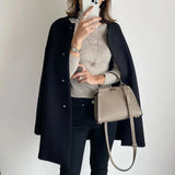 Elegant lang oversize-kåpe for dame