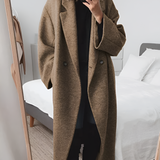 Elegant oversize damekåpe med dobbeltspent lukking