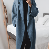 Elegant oversize damekåpe med dobbeltspent lukking