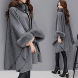 Elegant cape for dame med ståkrage og vide ermer